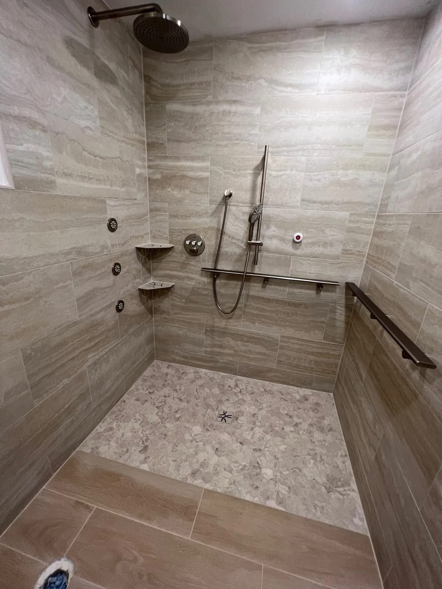 Entry into the walk-in shower from wood-look floor tile