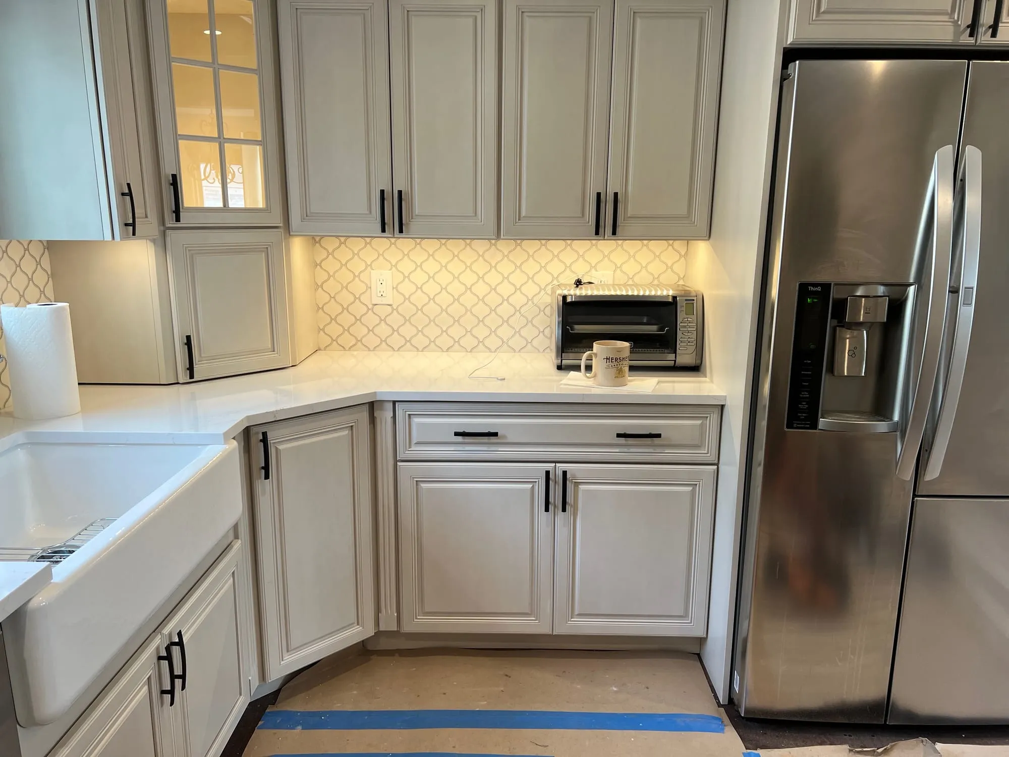 Cabinets and countertops installed with the floor still protected during construction