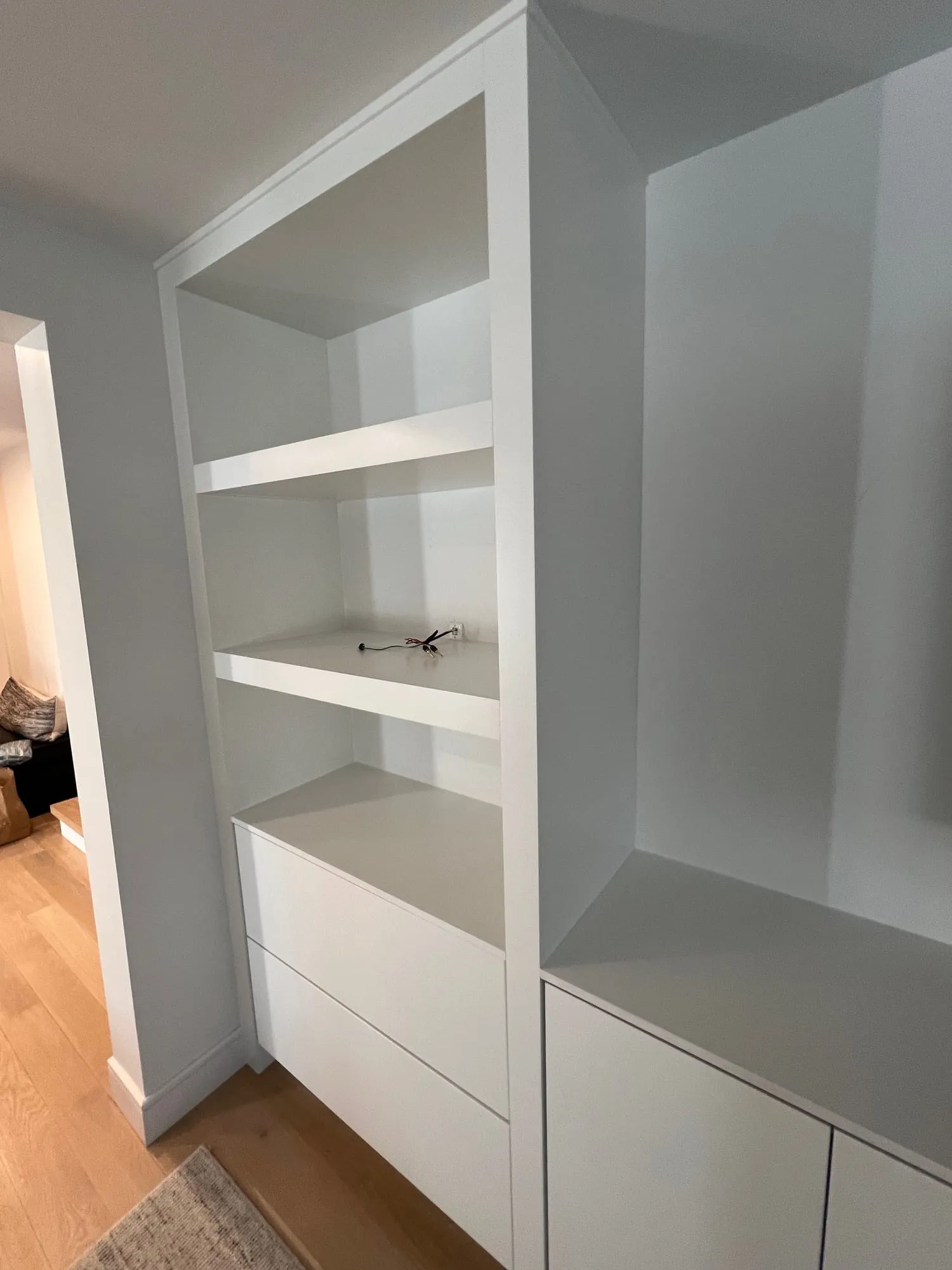Side view of the built-in shelving and drawer base